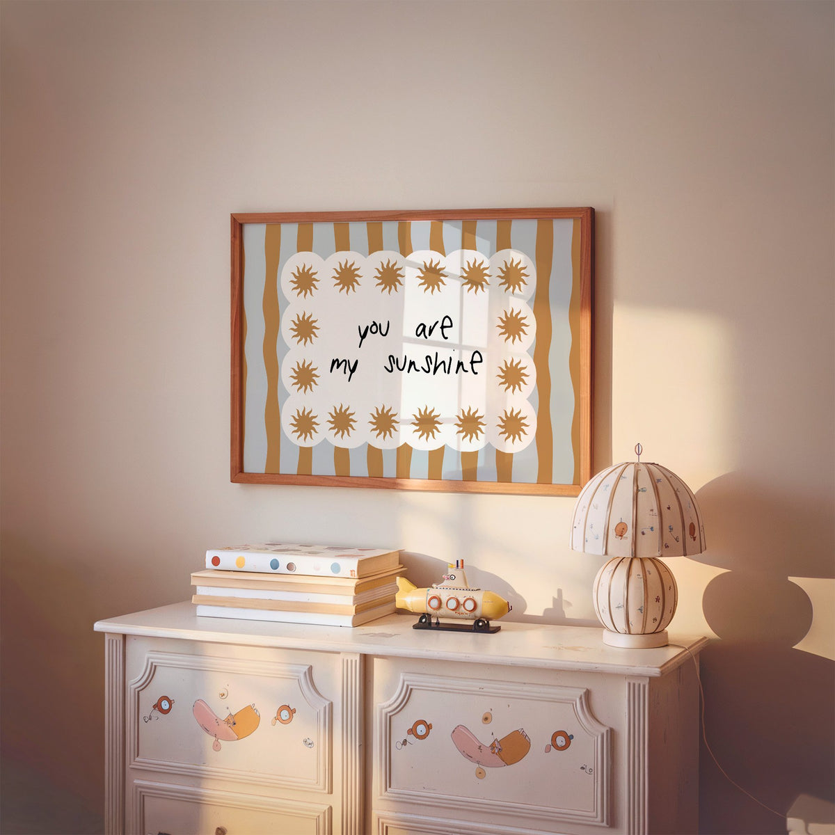 Landscape my sunshine sun border nursery print in a cherry wood frame above a painted dresser and lamp