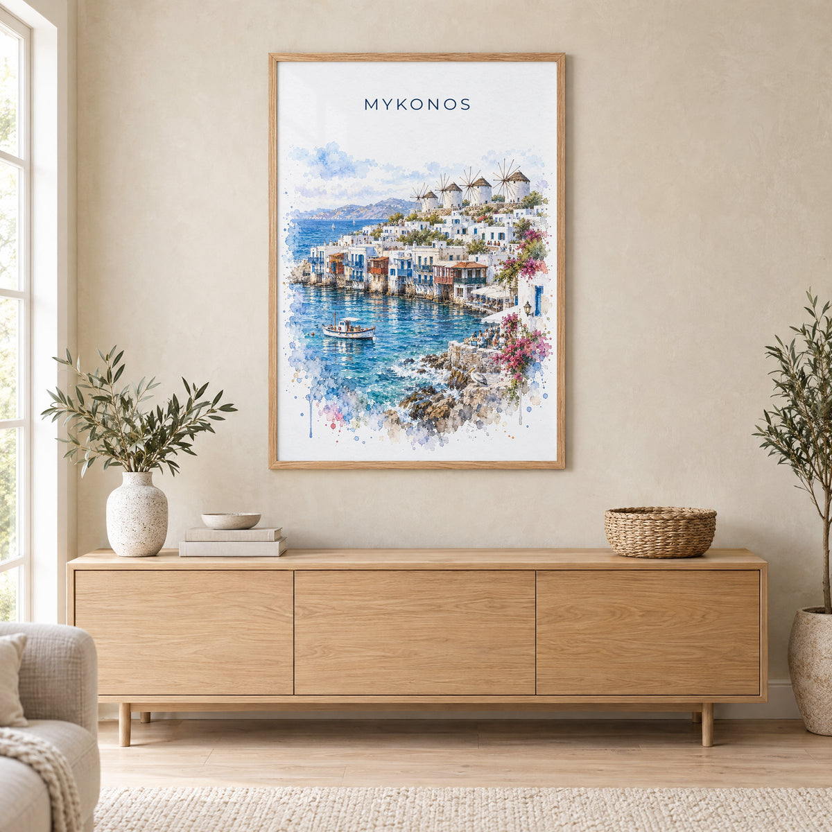 Mykonos watercolor print in an oak frame above a light wood sideboard in a Scandinavian living room