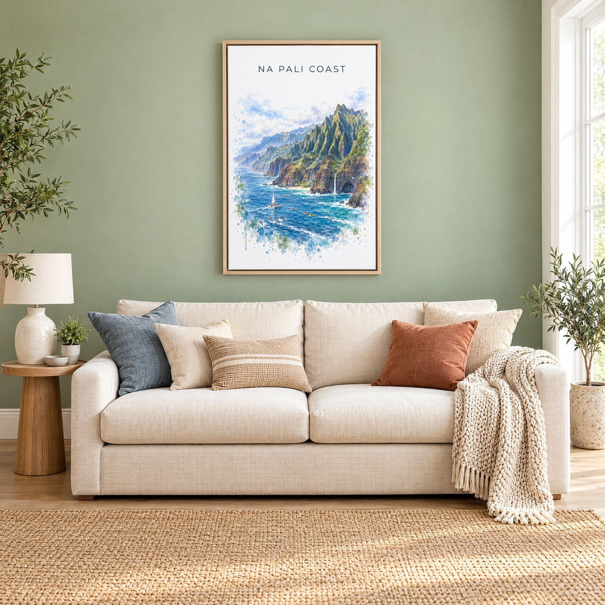 Na Pali Coast watercolor print as a natural floater canvas above a cream linen sofa on a sage green wall