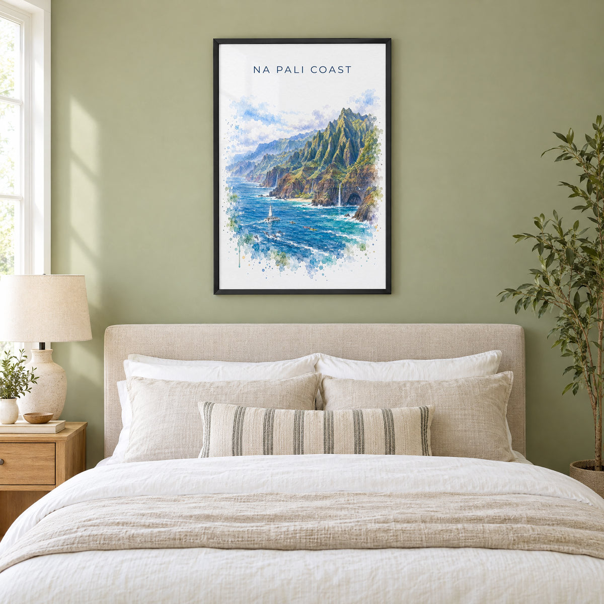 Na Pali Coast watercolor print in a black frame above an upholstered headboard in a sage green bedroom
