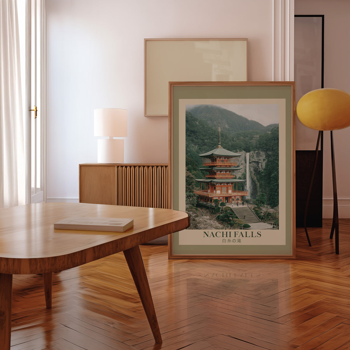 Nachi Falls and red pagoda print in a walnut frame leaning in a mid-century living room