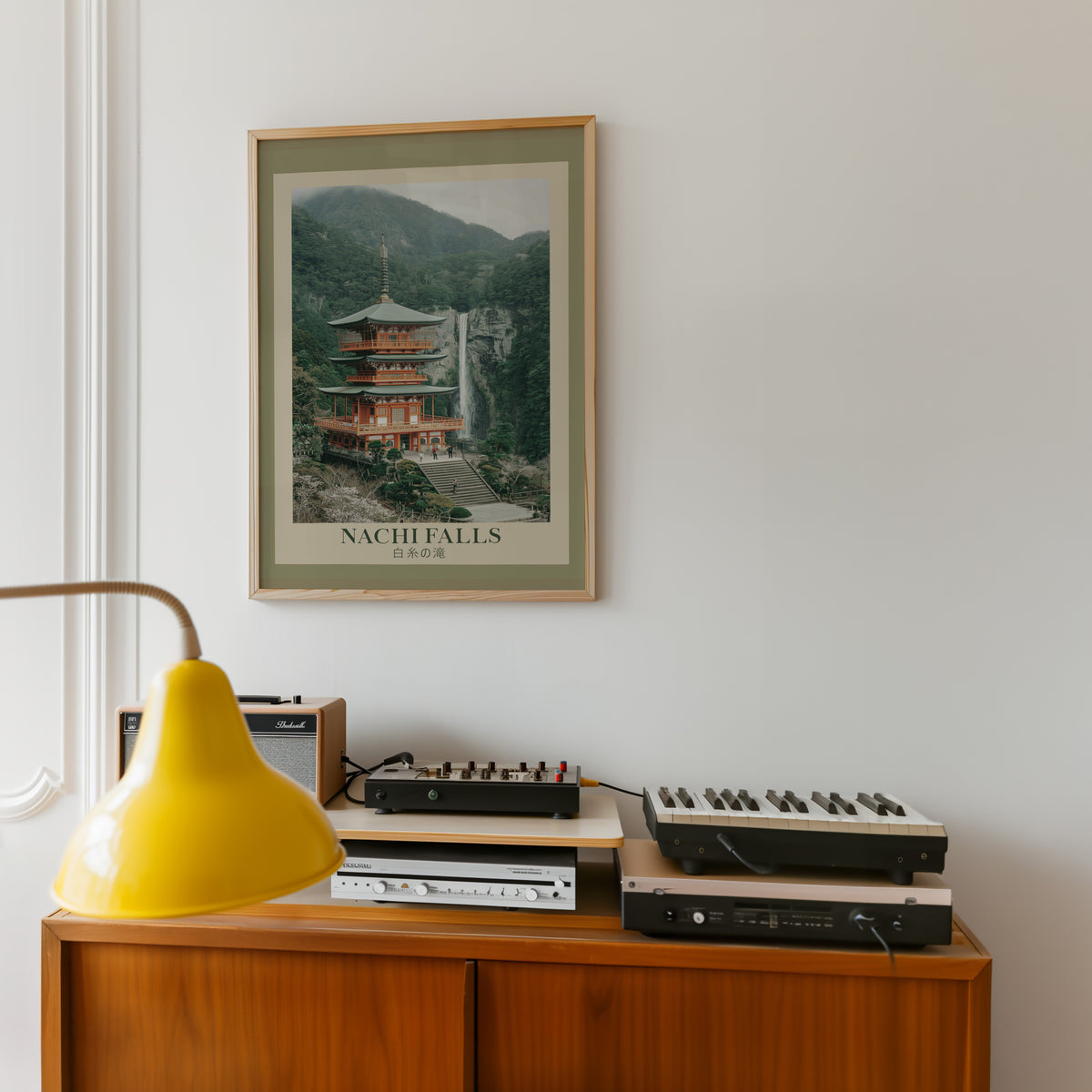 Nachi Falls and red pagoda print in an oak frame above a teak sideboard with vintage hi-fi