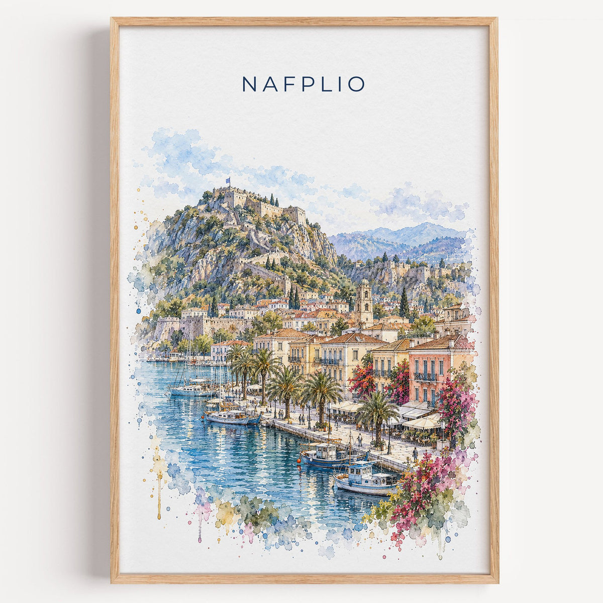 Nafplio watercolor print in a light oak frame on a plain white wall