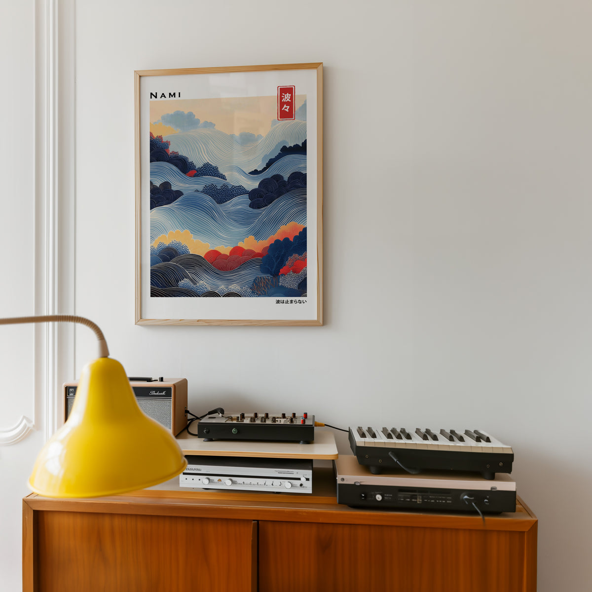 Blue layered Nami wave print in an oak frame above a teak sideboard with vintage hi-fi