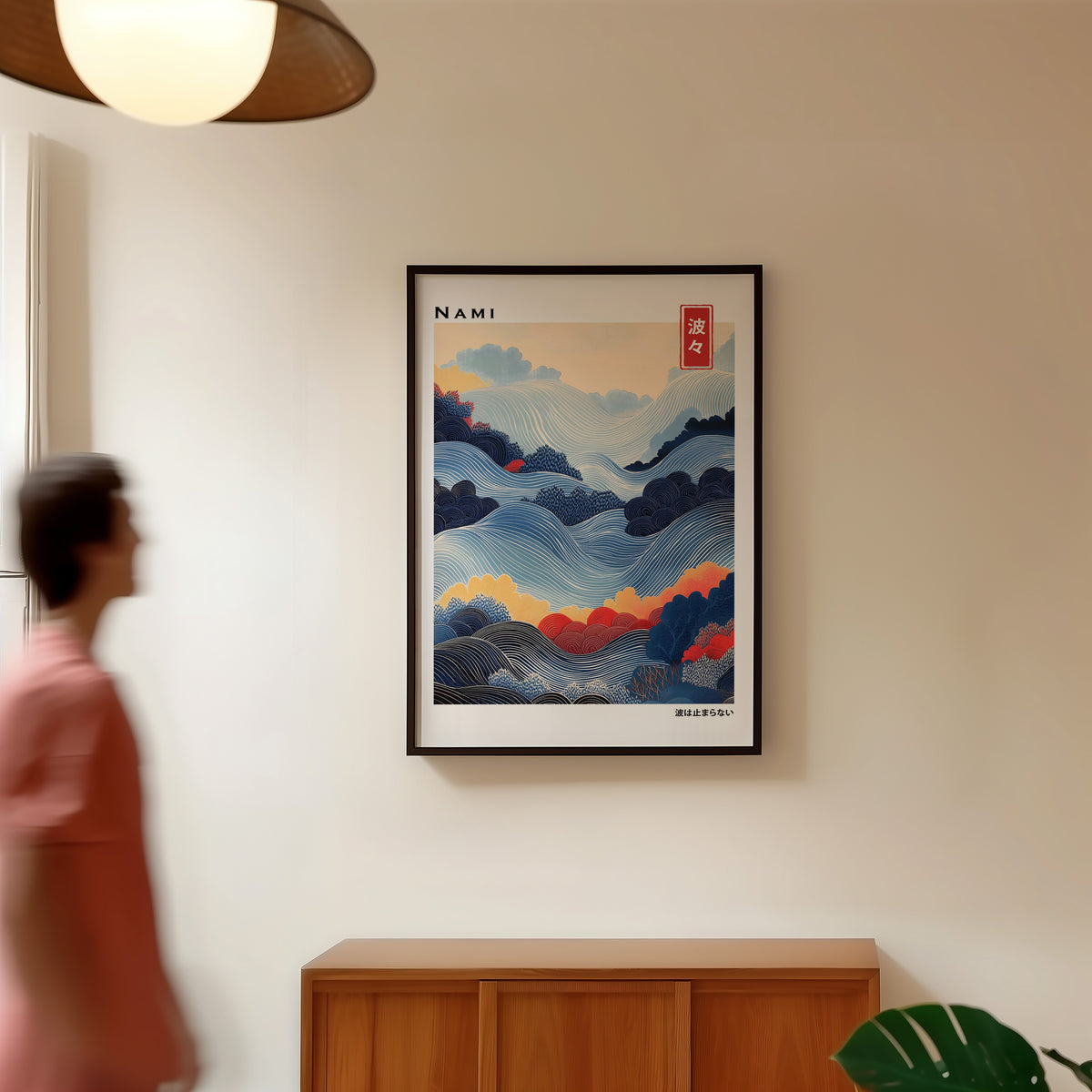 Blue layered Nami wave print in a black frame in a hallway under a rattan pendant