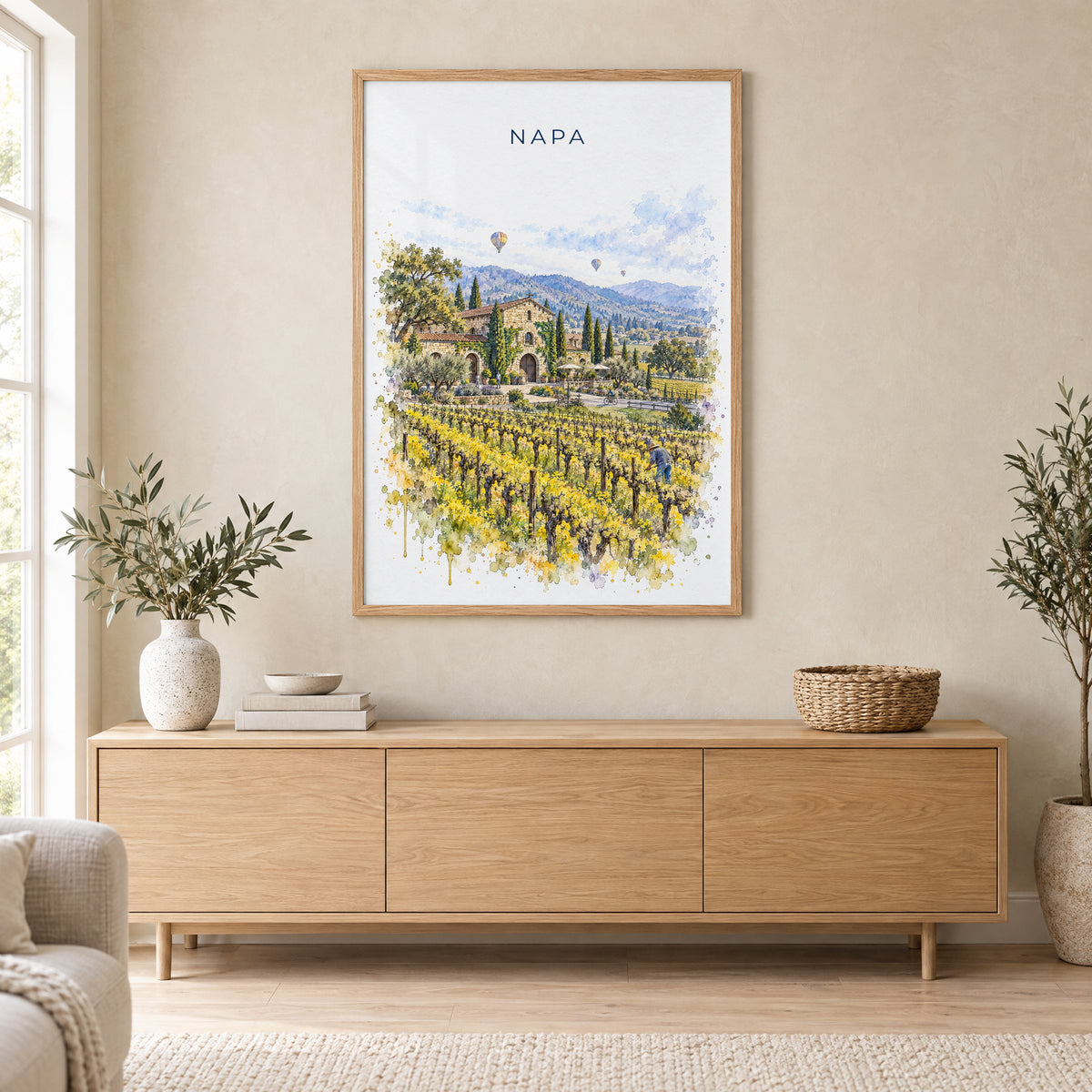 Napa watercolor print in an oak frame above a light wood sideboard in a Scandinavian living room