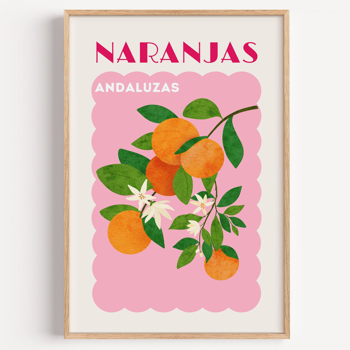 NARANJAS ANDALUZAS orange branch print in a light oak frame on a plain white wall