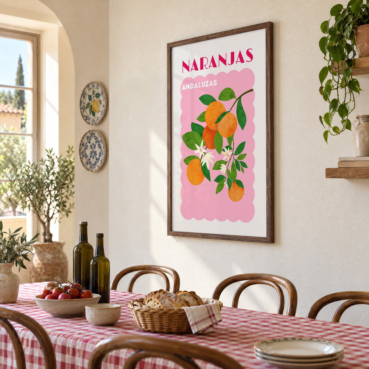 NARANJAS ANDALUZAS orange branch print in a walnut frame above a gingham-covered trattoria table, seen at an angle