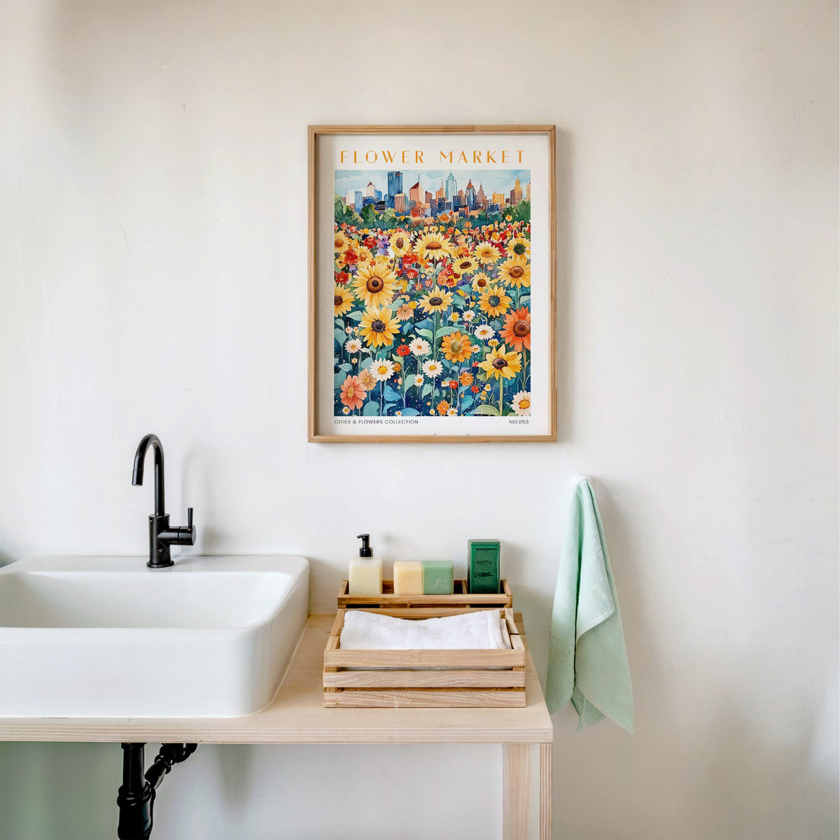 Nashville flower market print in an oak frame above a white bathroom sink with folded towels