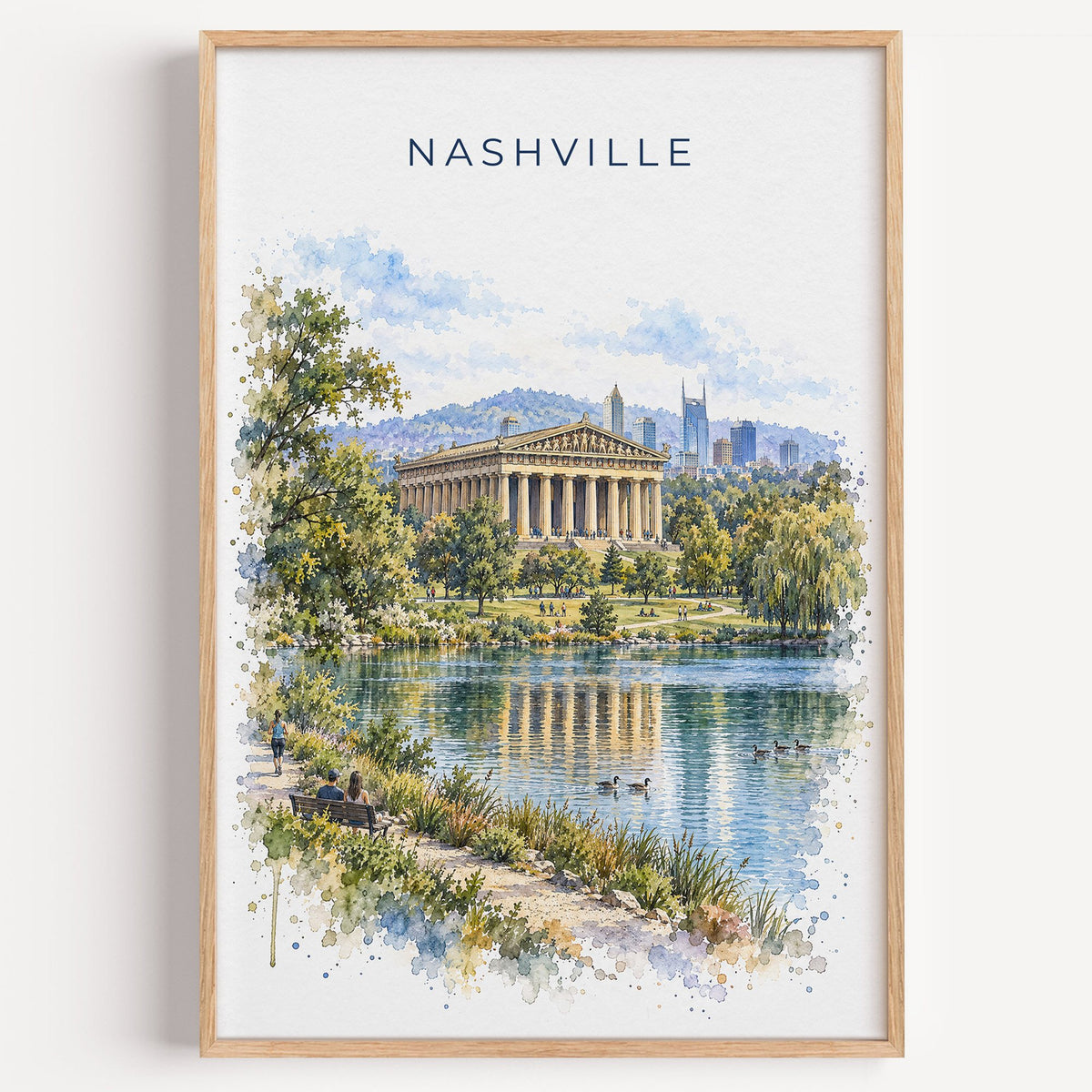 Nashville Parthenon watercolor print in a light oak frame on a plain white wall