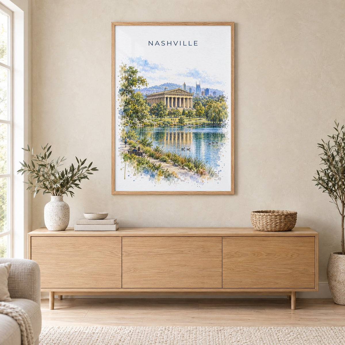 Nashville Parthenon watercolor print in an oak frame above a light wood sideboard in a Scandinavian living room