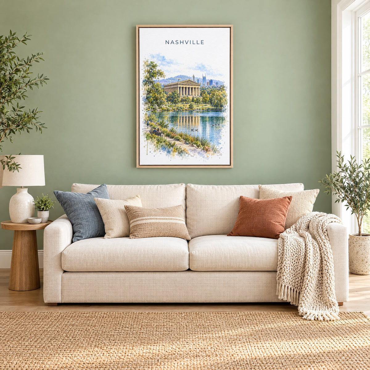 Nashville Parthenon watercolor print as a natural floater canvas above a cream linen sofa on a sage green wall
