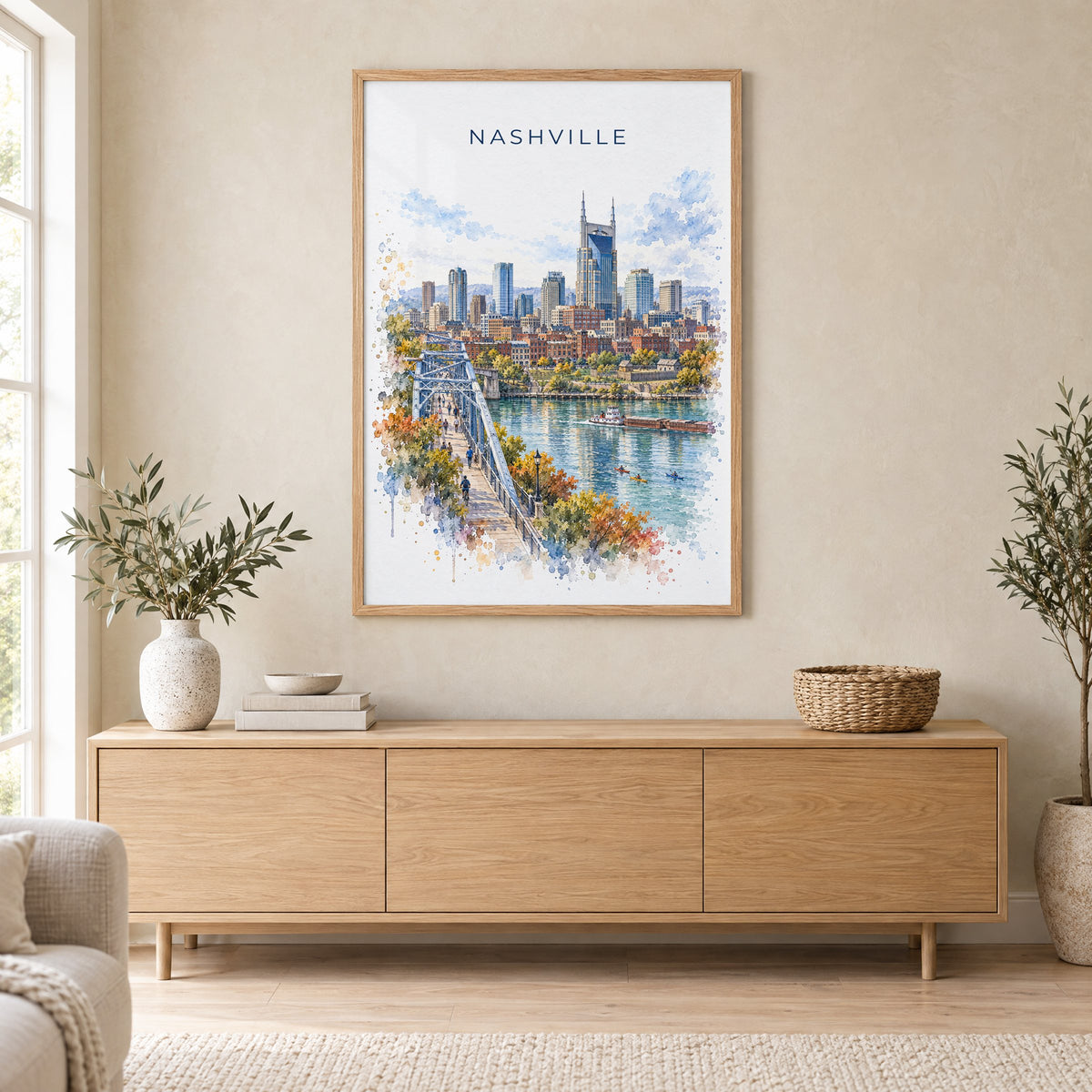 Nashville watercolor print in an oak frame above a light wood sideboard in a Scandinavian living room