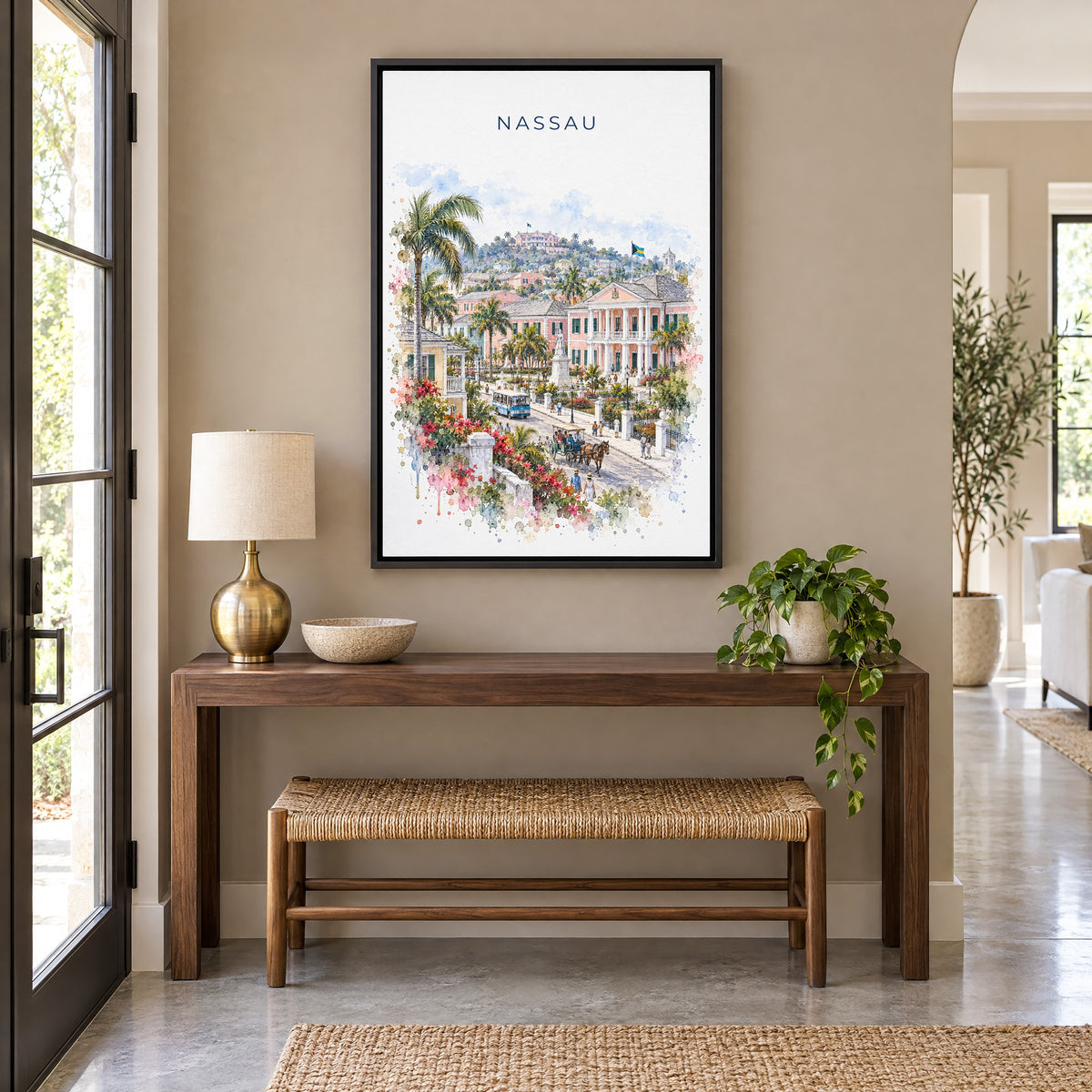 Nassau watercolor print as a black floater canvas above a walnut console and woven bench in an entryway