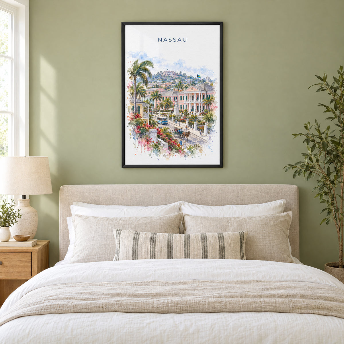 Nassau watercolor print in a black frame above an upholstered headboard in a sage green bedroom
