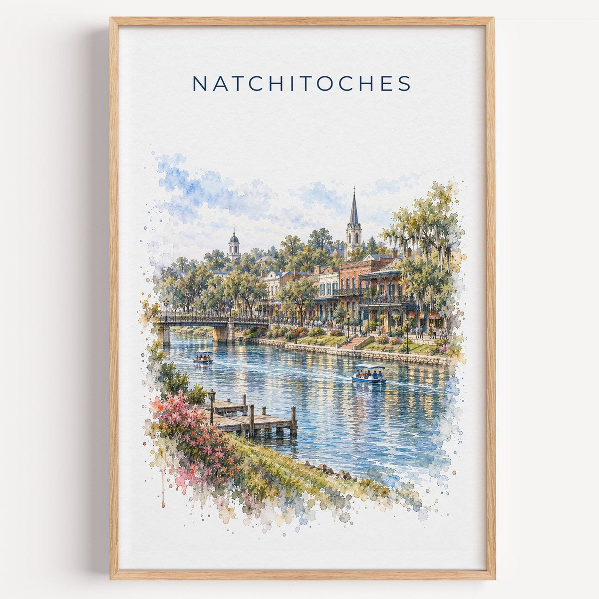 Natchitoches, Louisiana watercolor print in a light oak frame on a plain white wall
