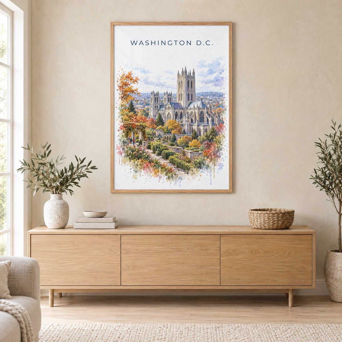Washington National Cathedral watercolor print in an oak frame above a light wood sideboard in a Scandinavian living room