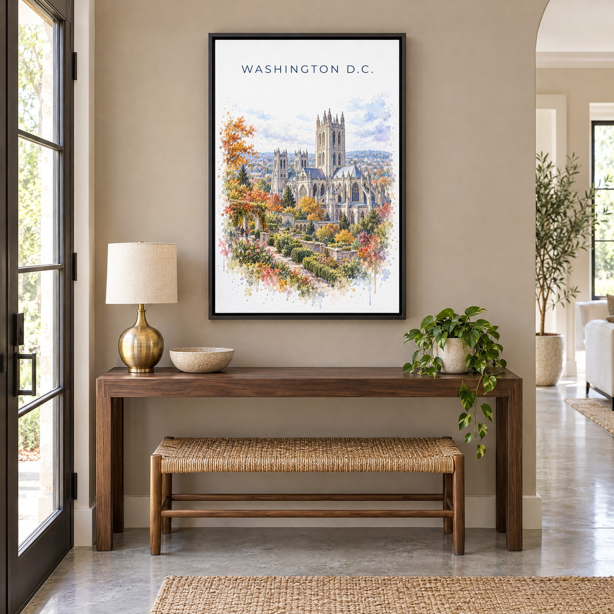 Washington National Cathedral watercolor as a black floater canvas above a walnut console and woven bench in an entryway