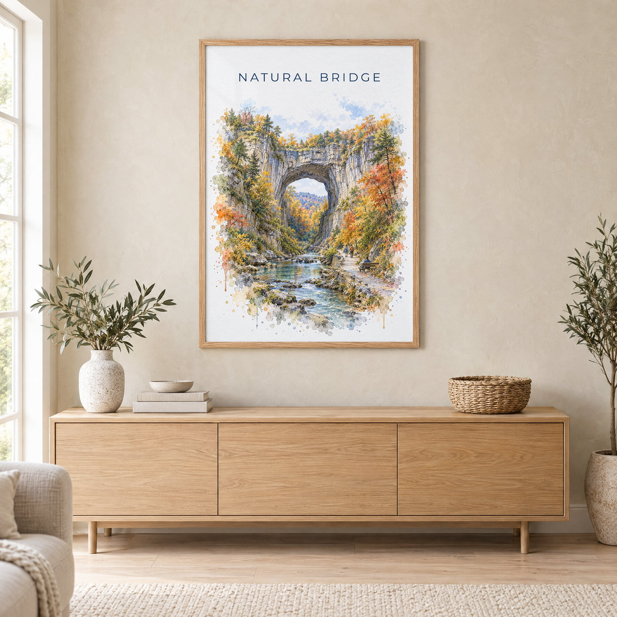 Natural Bridge, Virginia watercolor print in an oak frame above a light wood sideboard in a Scandinavian living room