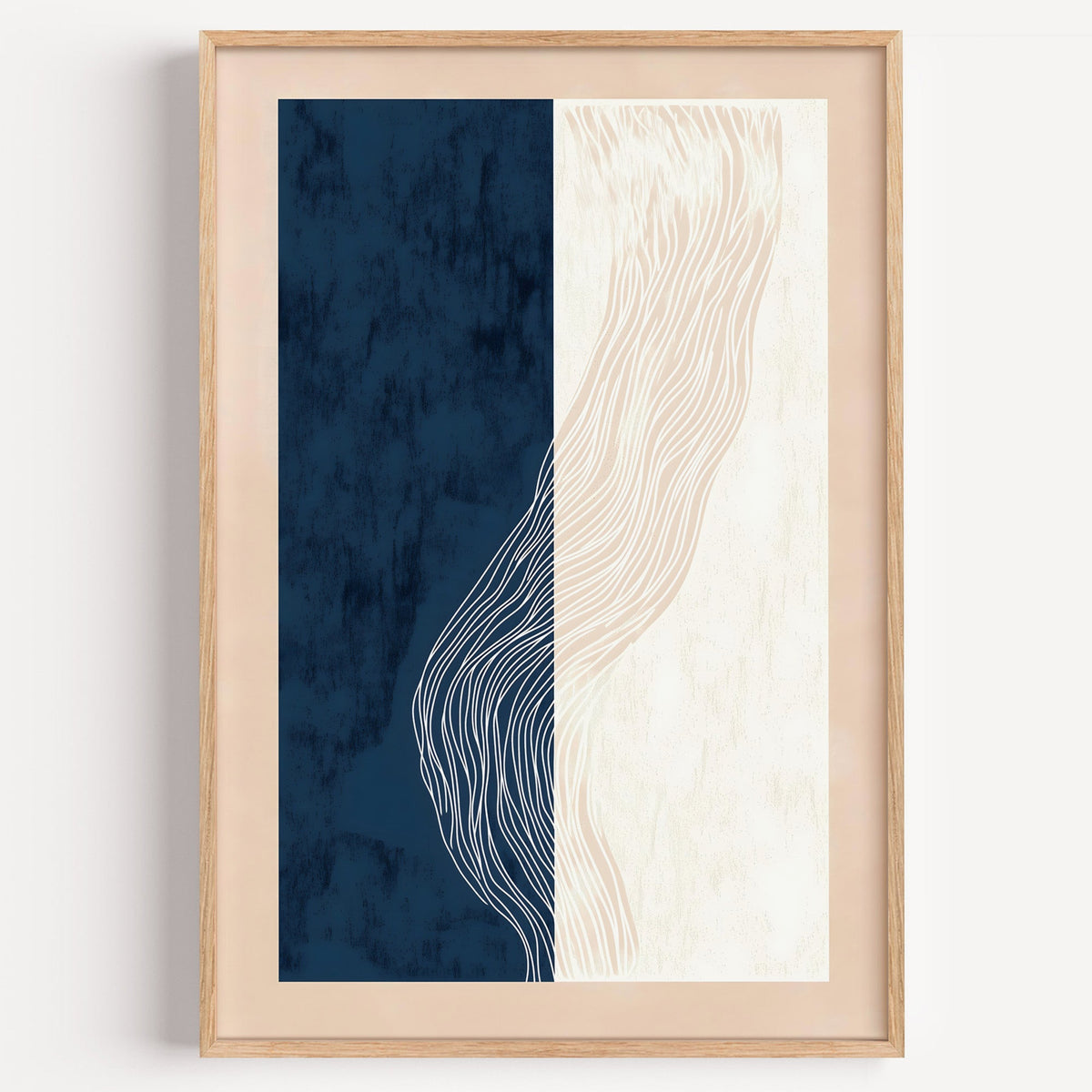 Navy and cream split panel line art print in a light oak frame on a plain white wall