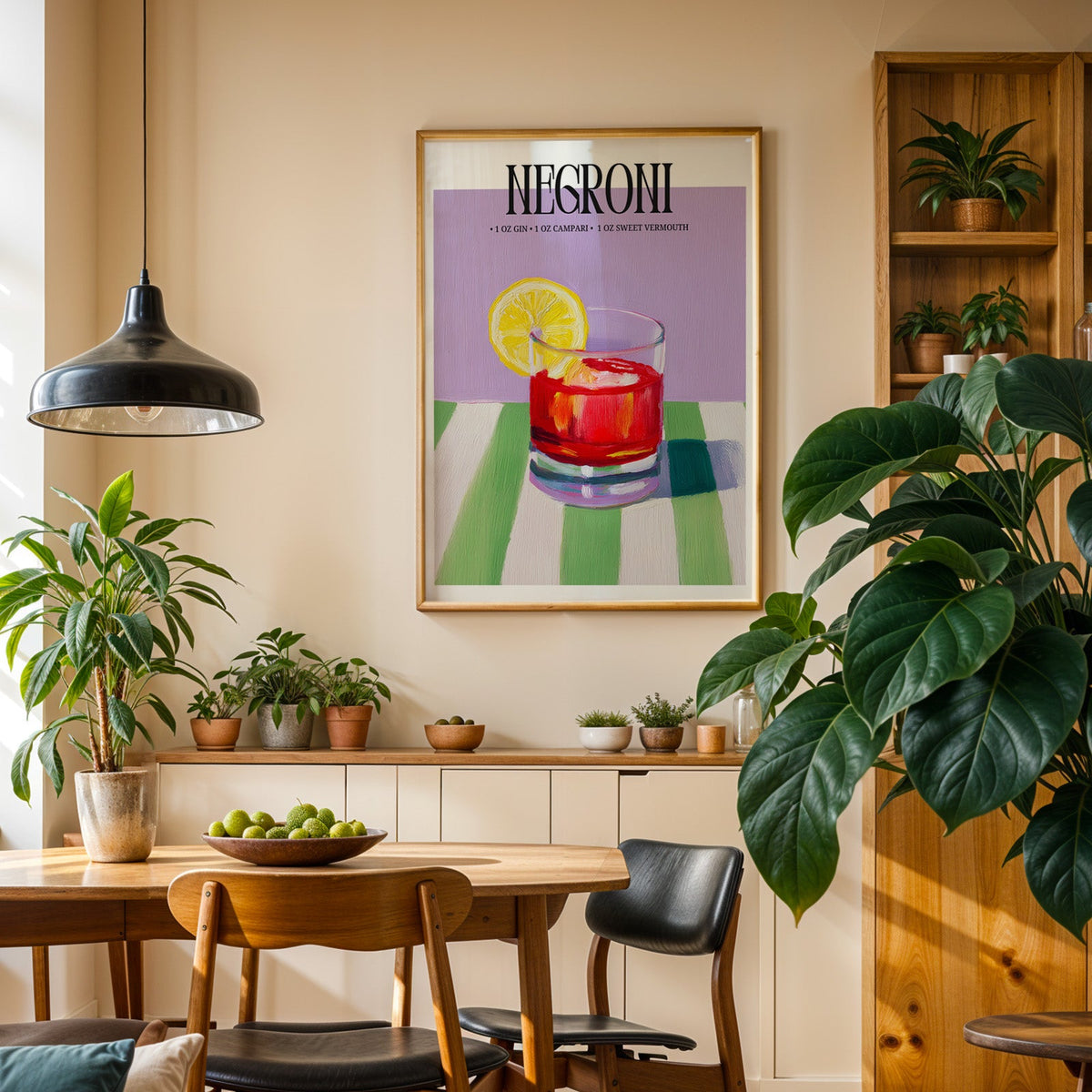 Negroni painterly print in an oak frame in a dining room above a plant-lined sideboard