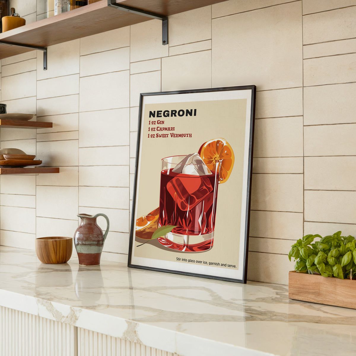 Negroni recipe print in a black frame leaning on a marble counter in a tiled kitchen