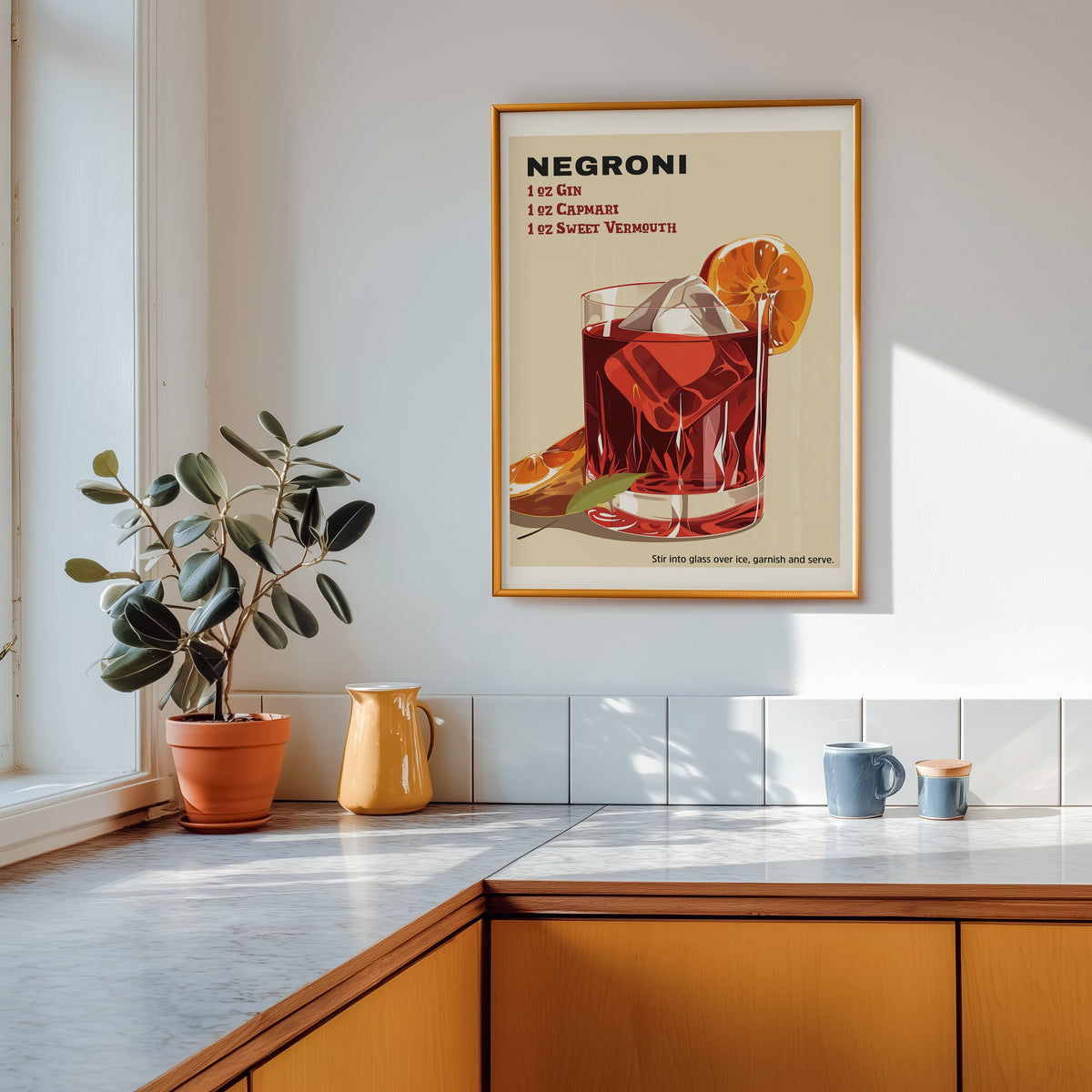 Negroni recipe print shown in a gold frame above a marble counter in a tan kitchen