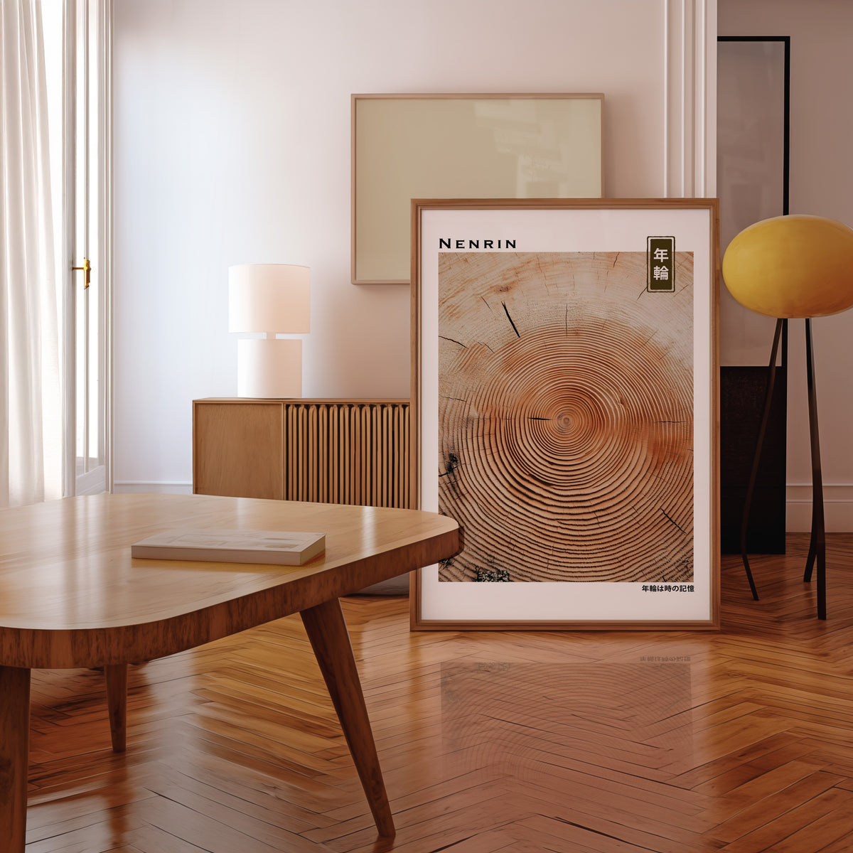 Orange-brown wood slice tree rings print in a walnut frame leaning in a mid-century living room