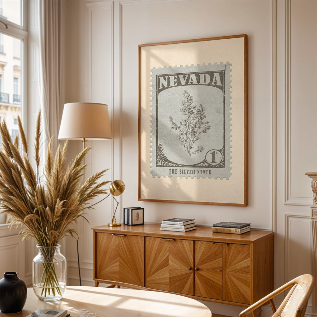 Nevada stamp print framed above a wooden sideboard, pampas grass in a glass vase and a floor lamp