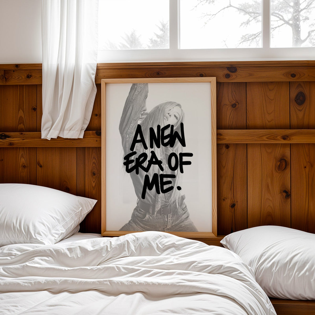 A new era of me lettering over woman in denim print in a pine frame leaning on a wood headboard over white bedding