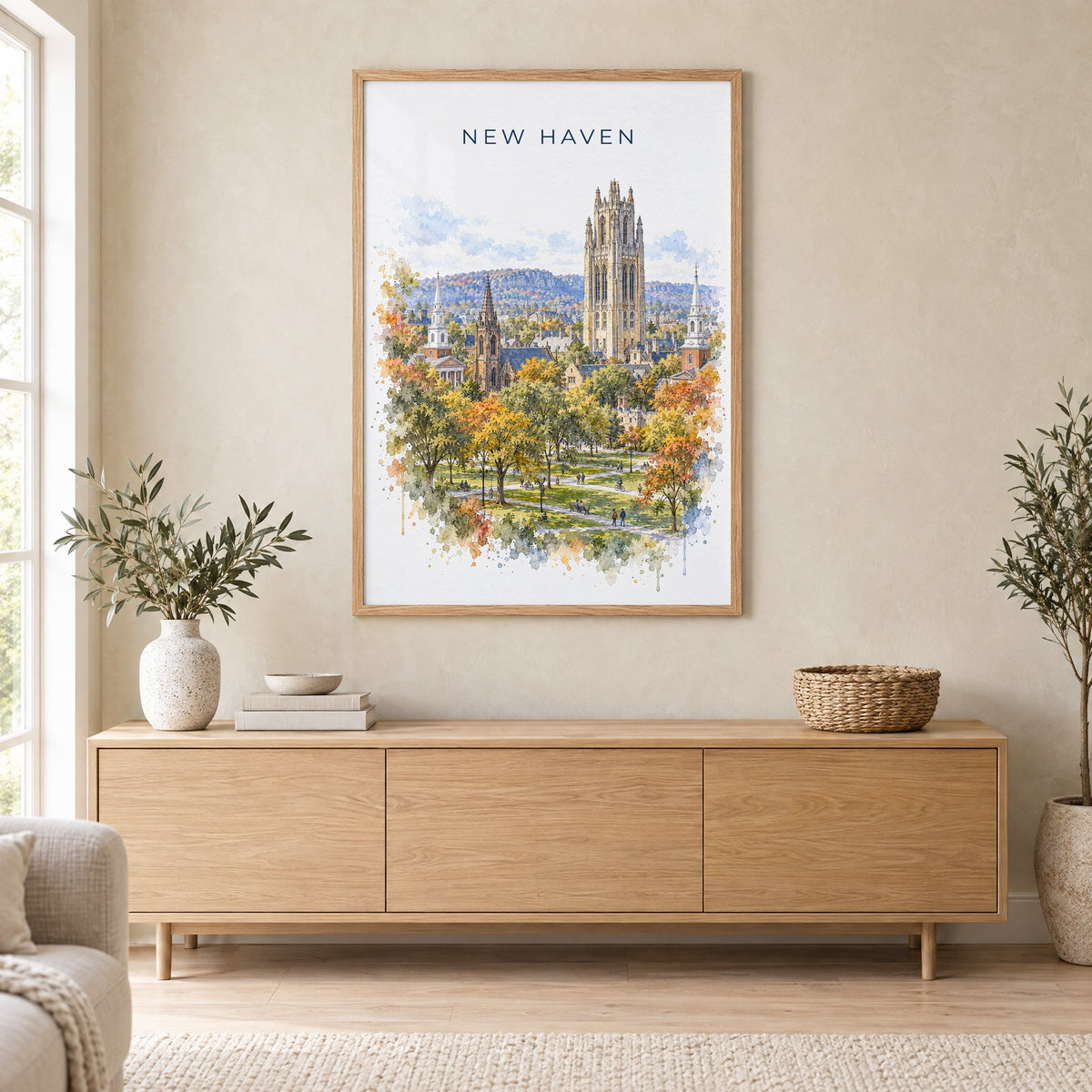 New Haven watercolor print in an oak frame above a light wood sideboard in a Scandinavian living room