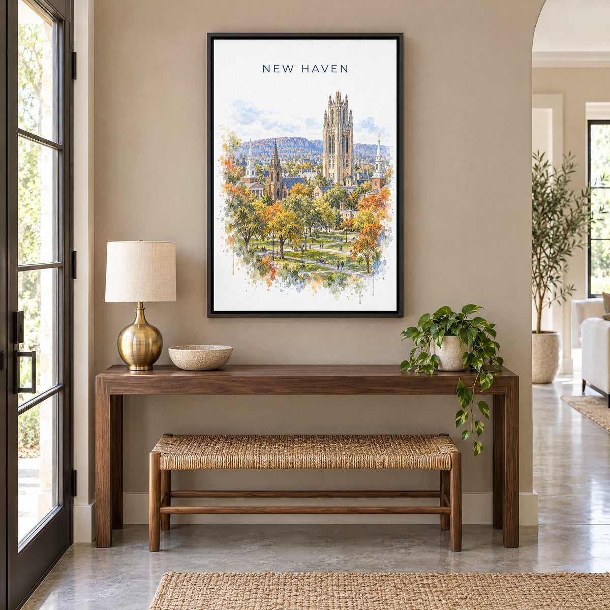 New Haven watercolor print as a black floater canvas above a walnut console and woven bench in an entryway