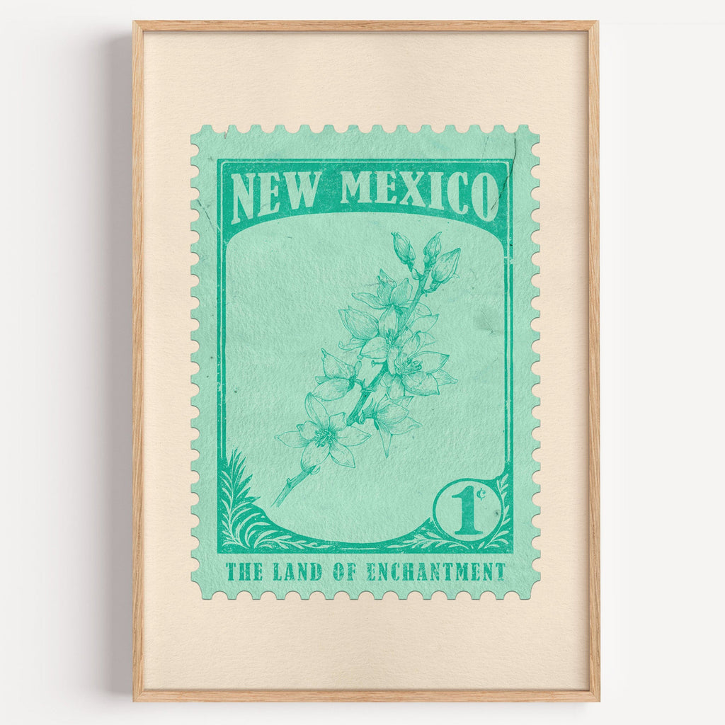 New Mexico state flower stamp print in emerald on mint, light oak frame on a plain white wall