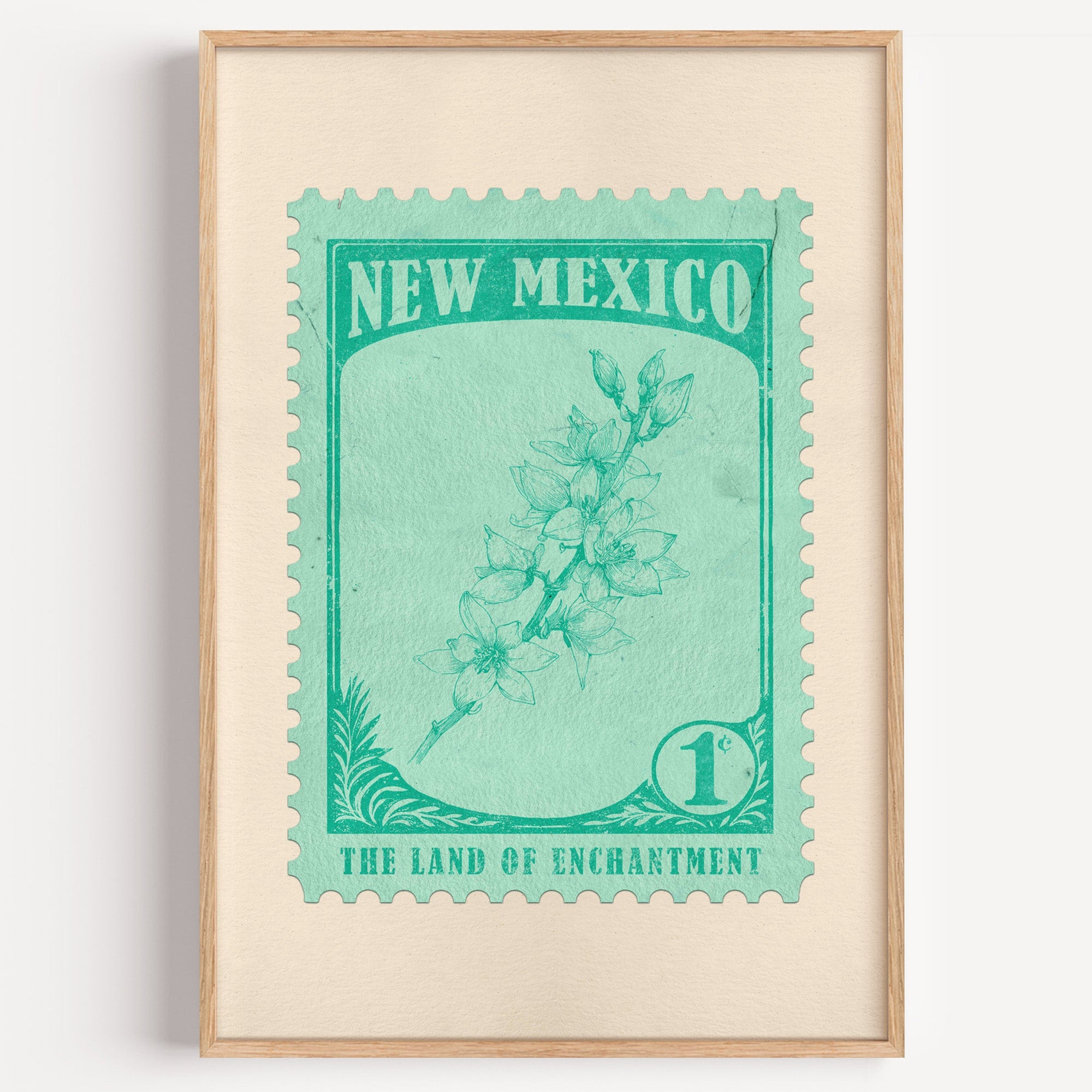 New Mexico state flower stamp print in emerald on mint, light oak frame on a plain white wall