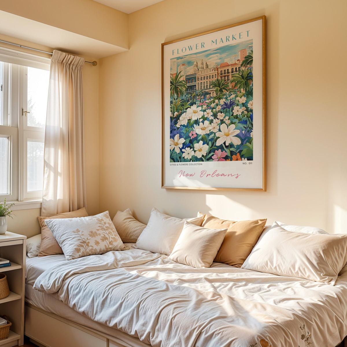New Orleans flower market print in an oak frame above a cream daybed in a sunny bedroom