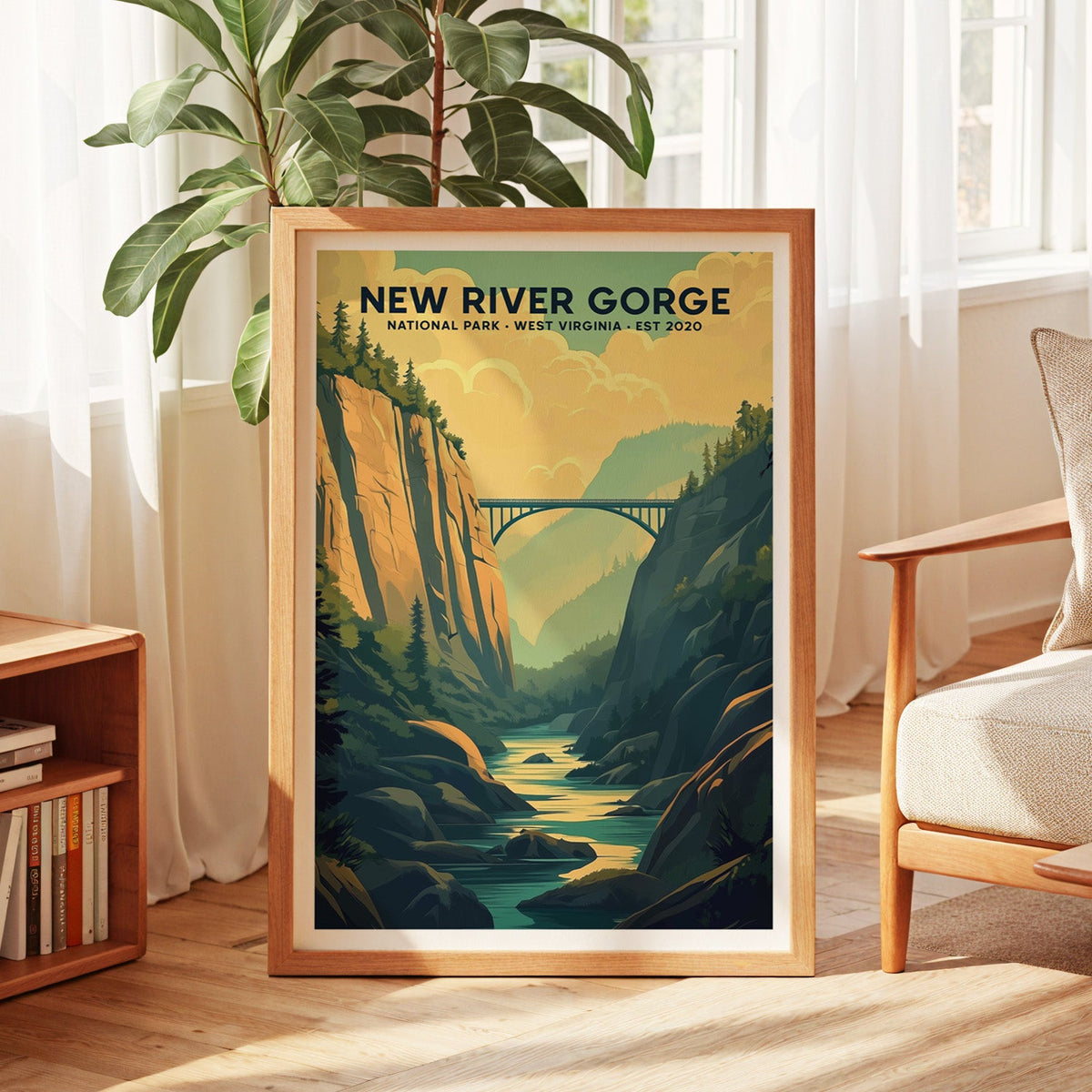 New River Gorge National Park print in an oak frame by a sunlit window with sheer curtains and a fig plant