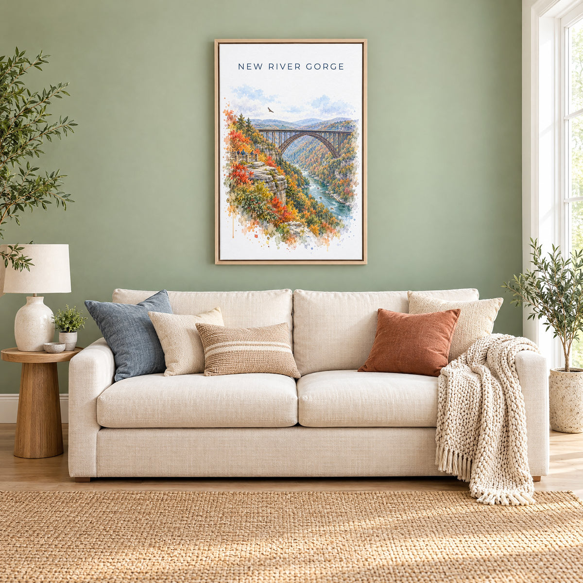 New River Gorge National Park watercolor print as a natural floater canvas above a cream linen sofa on a sage green wall