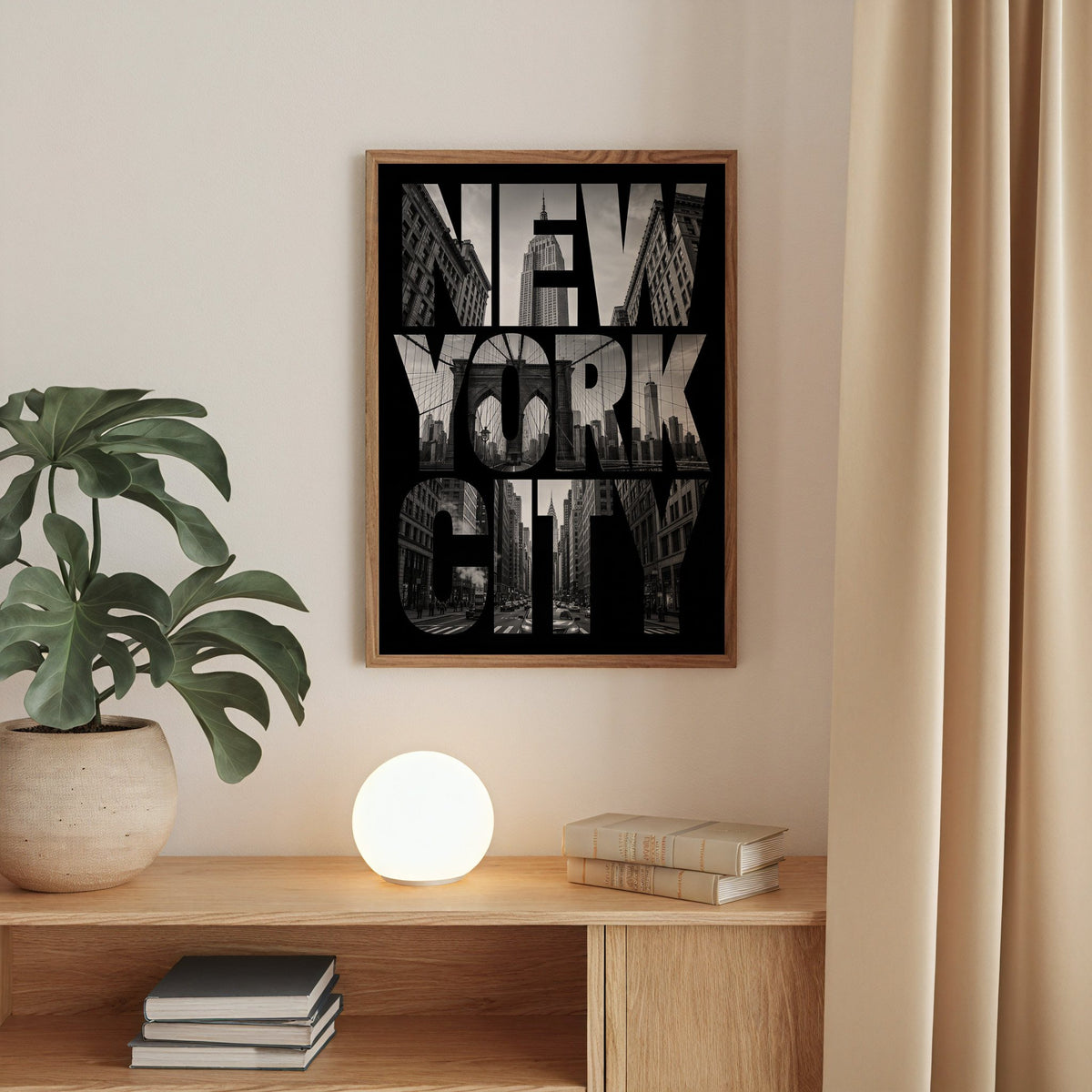 New York City letters filled with skyline photo print in a walnut frame above an oak cabinet with a glowing globe lamp
