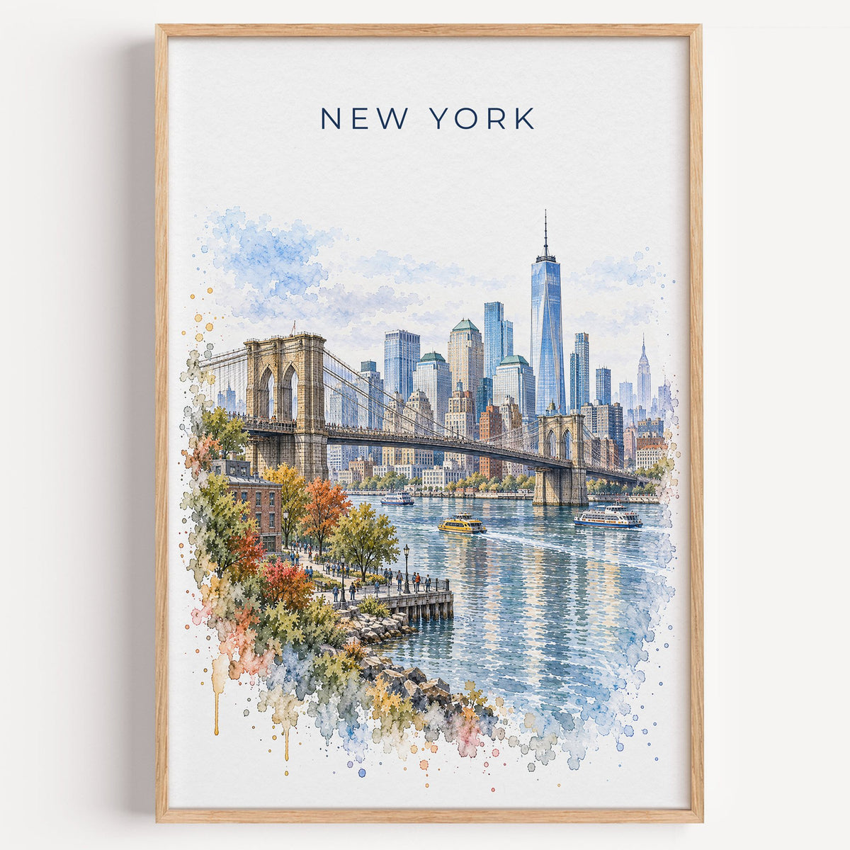 New York City watercolor print in a light oak frame on a plain white wall