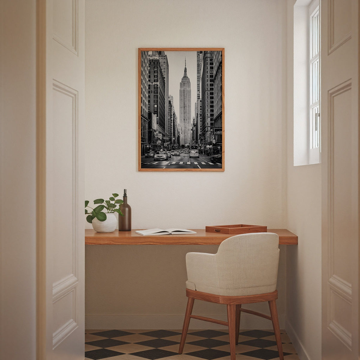 Empire State Building avenue with taxis print in an oak frame above a home office desk nook
