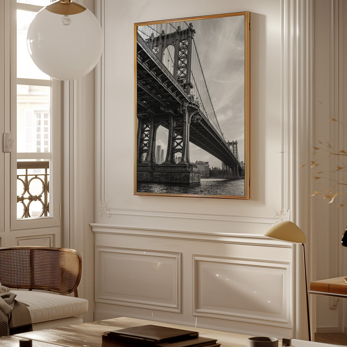 Manhattan Bridge underside from the river print shown in a gold frame in a Parisian paneled living room