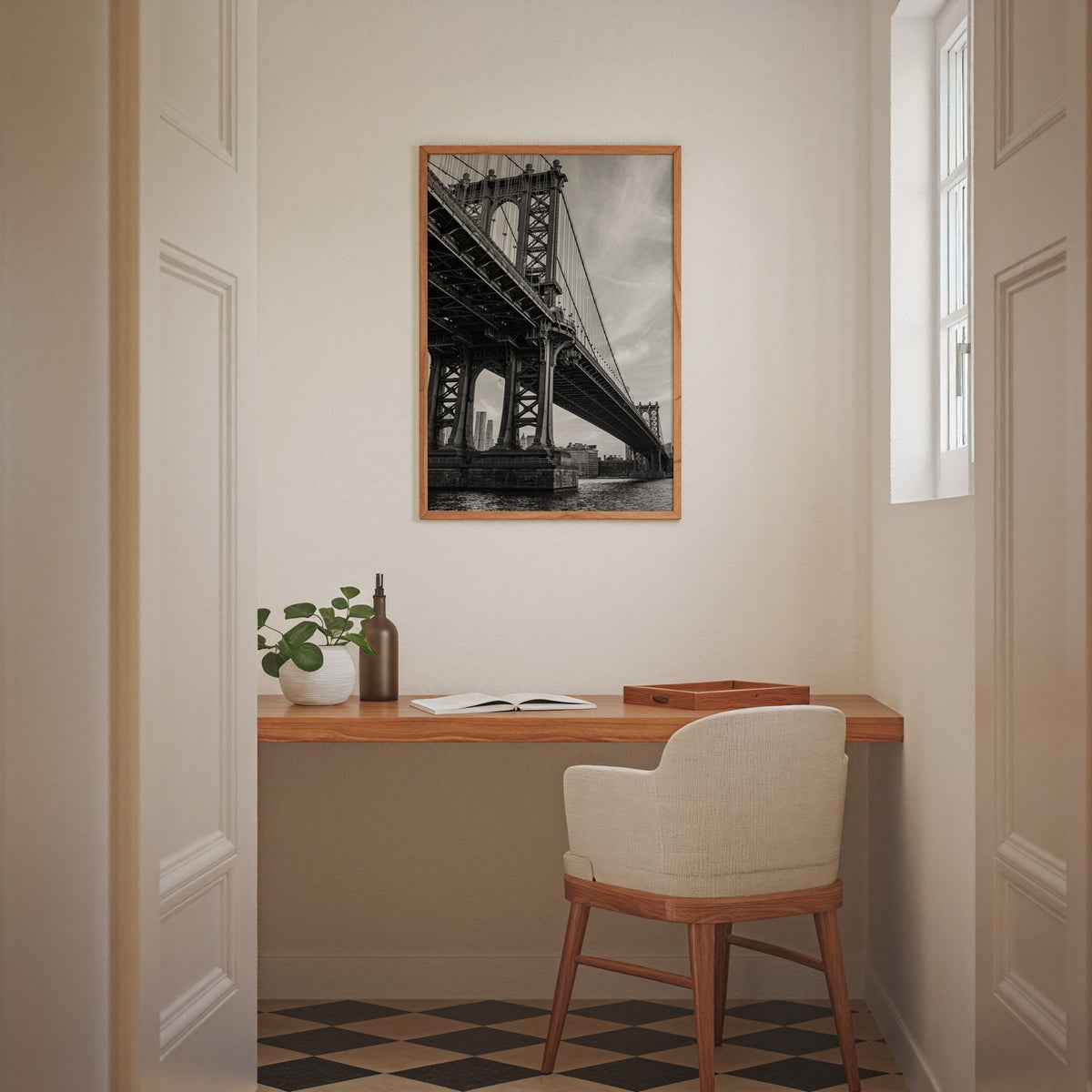 Manhattan Bridge underside from the river print in an oak frame above a home office desk nook