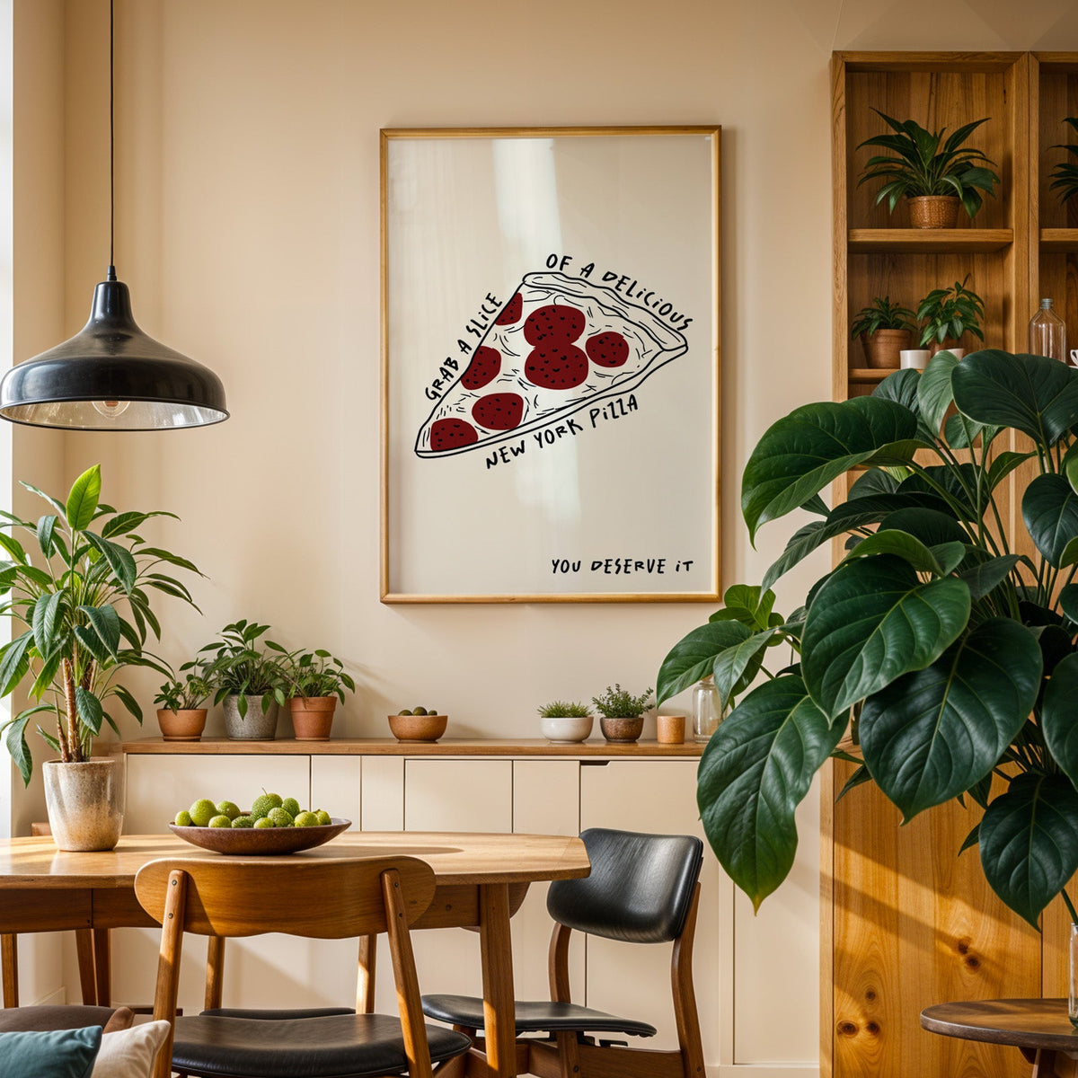New York pizza slice print in an oak frame above a sideboard in a plant-filled dining room