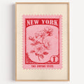 New York state flower stamp print in crimson on pink, light oak frame on a plain white wall