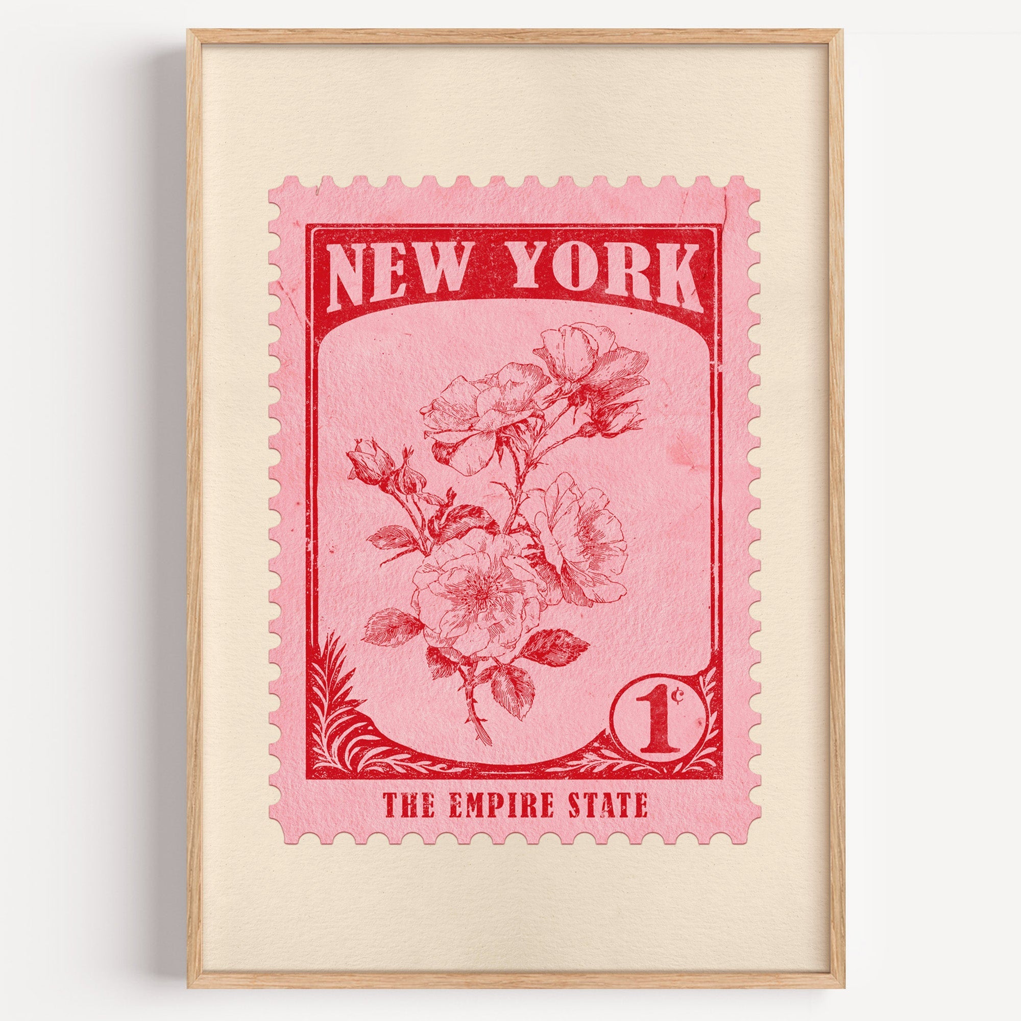 New York state flower stamp print in crimson on pink, light oak frame on a plain white wall