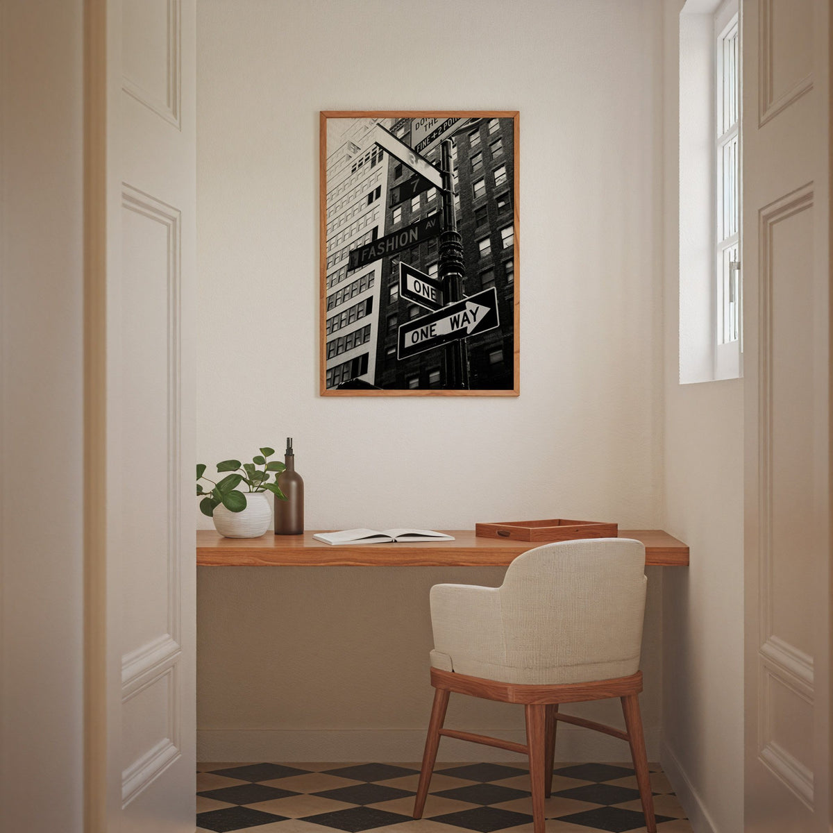 New York street sign pole with one way signs print in an oak frame above a home office desk nook