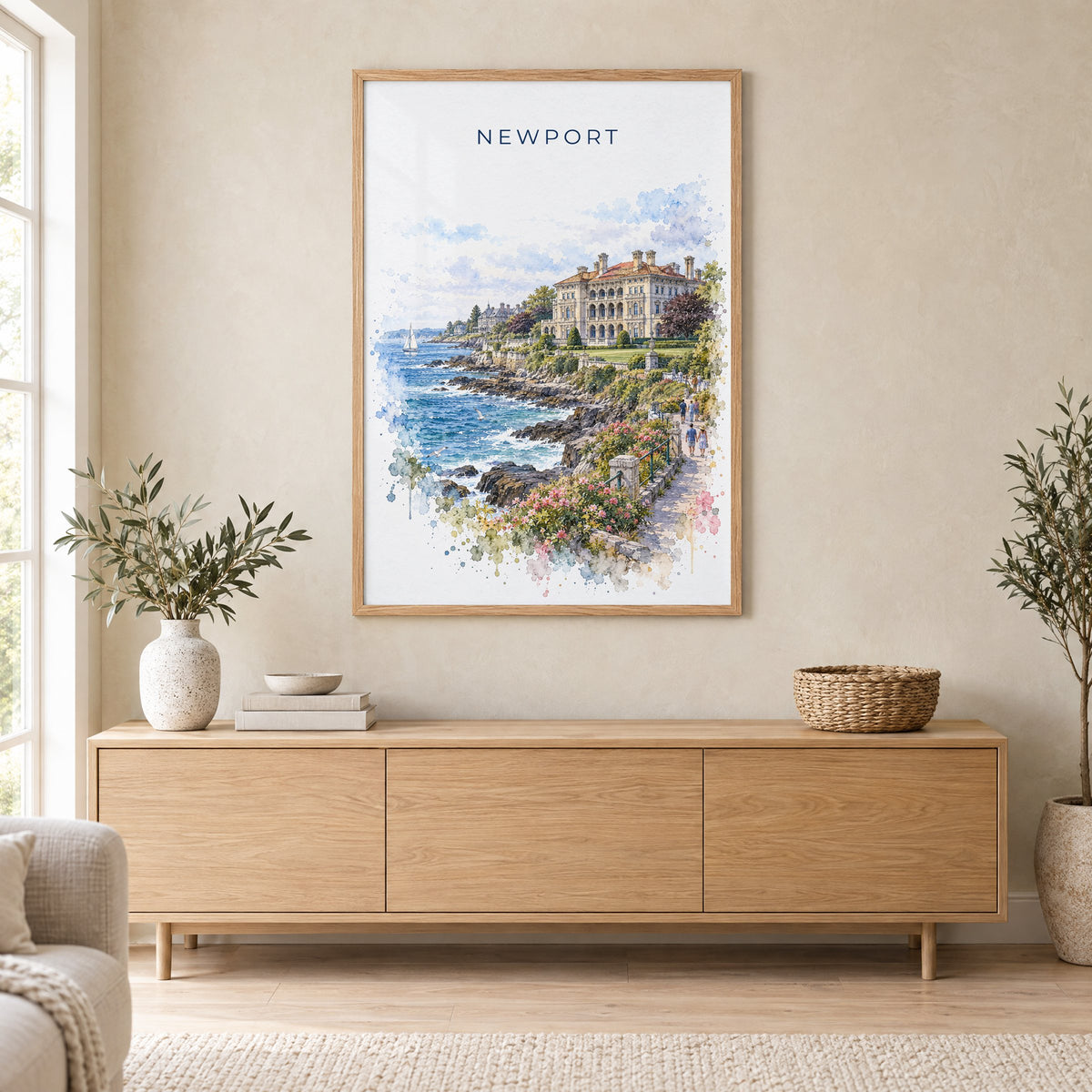 Newport, Rhode Island watercolor print in an oak frame above a light wood sideboard in a Scandinavian living room