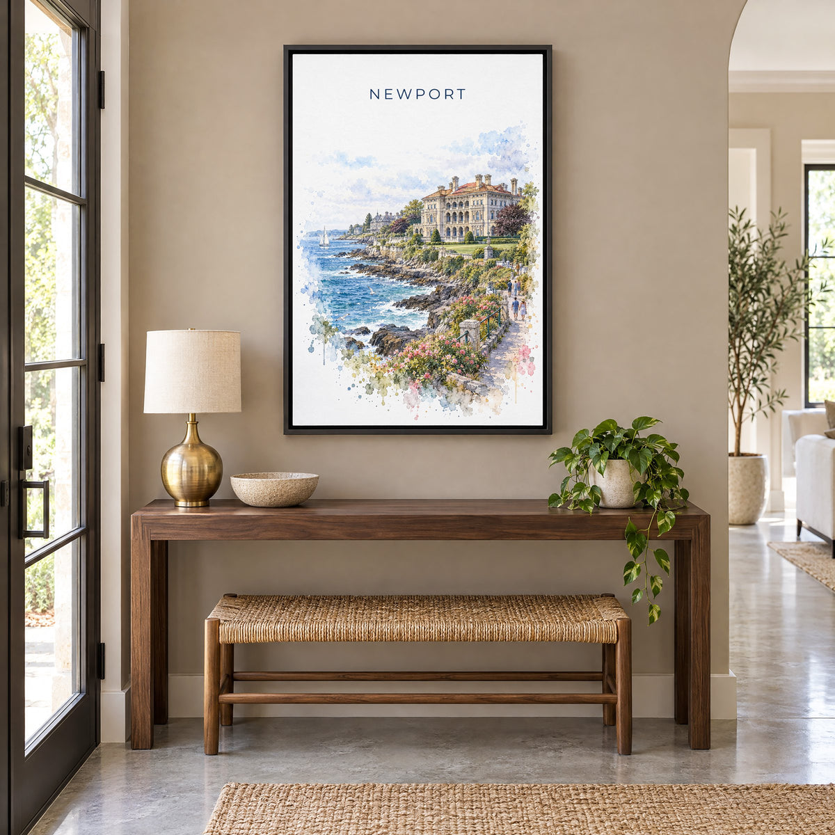 Newport, Rhode Island watercolor print as a black floater canvas above a walnut console and woven bench in an entryway
