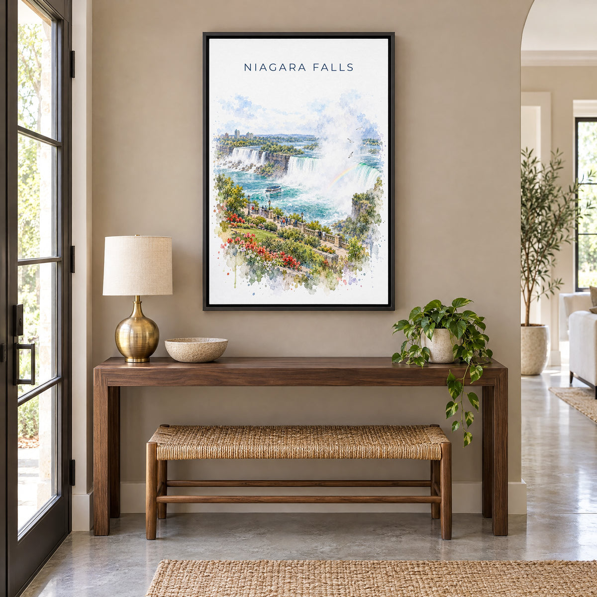 Niagara Falls watercolor print as a black floater canvas above a walnut console and woven bench in an entryway