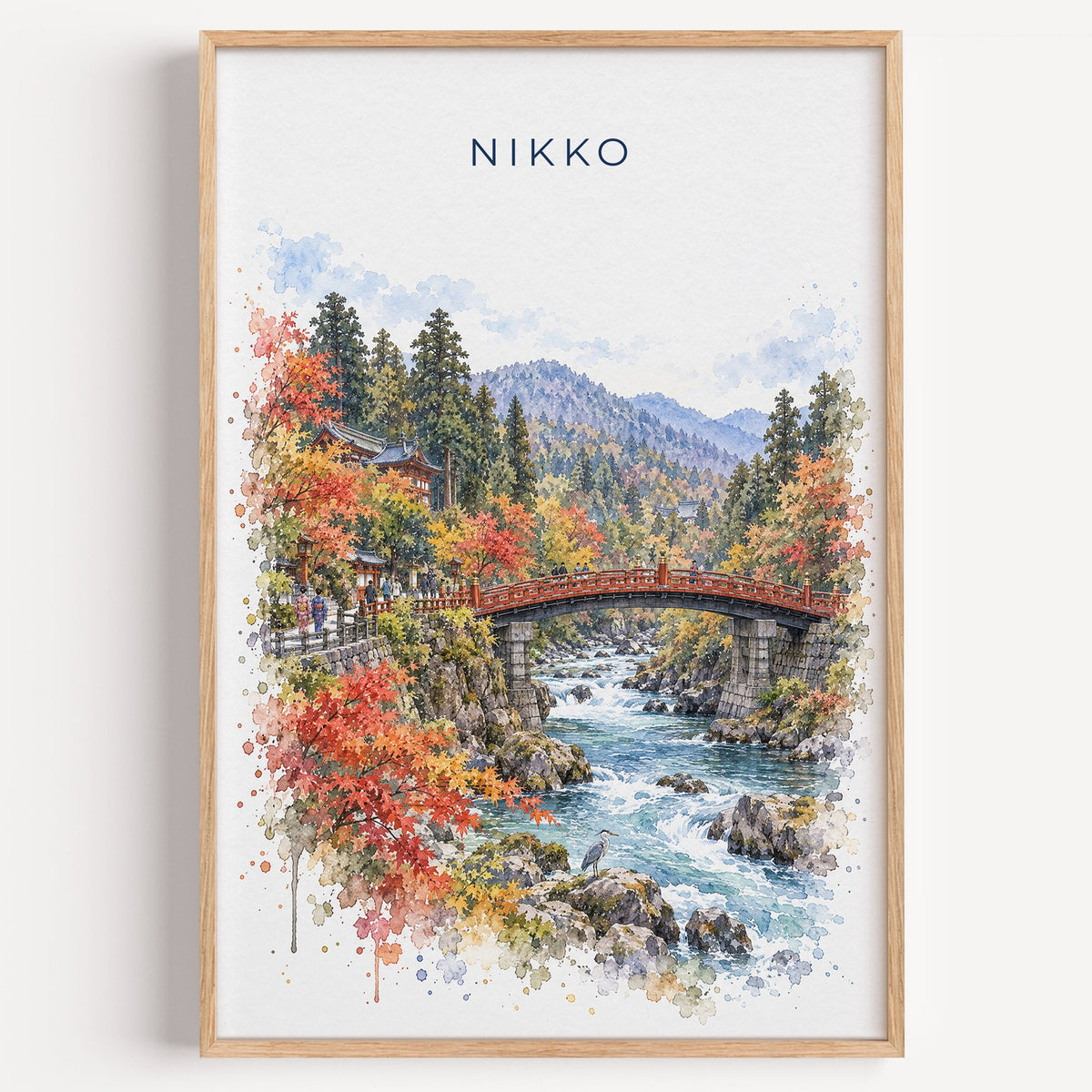 Nikko watercolor print in a light oak frame on a plain white wall